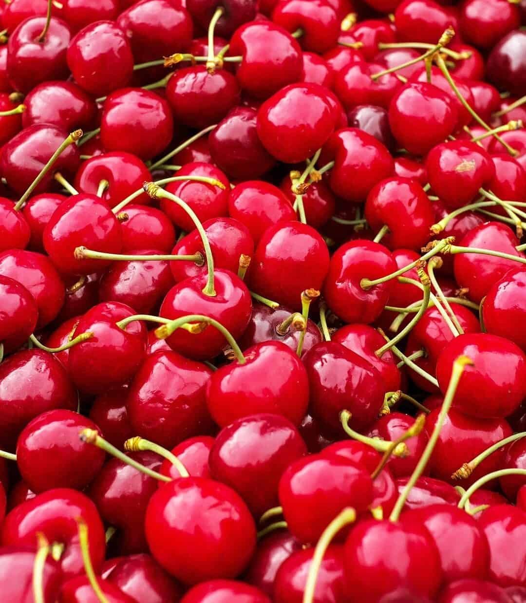 piles of red cherries