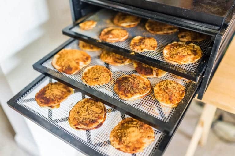 dehydrated food lined on three dehydrator trays