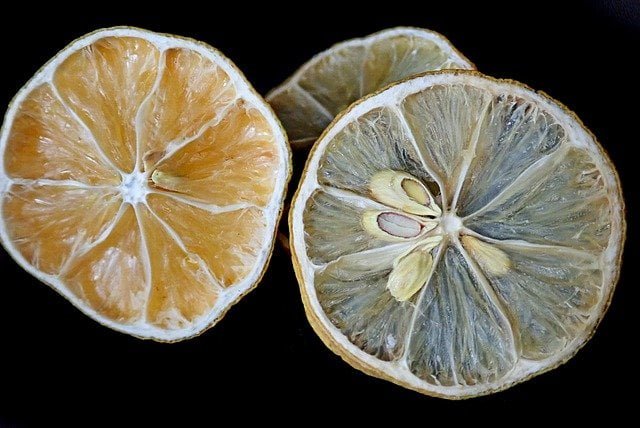 sliced dehydrated citrus with black background, dry lemon citrus