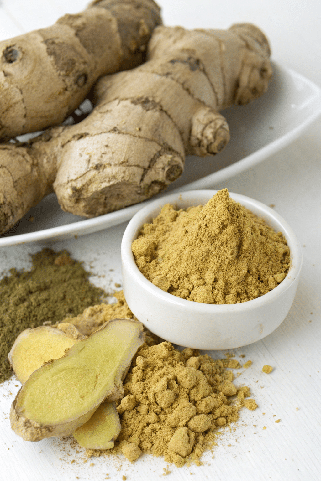 A side-by-side comparison of fresh ginger root and ginger powder, highlighting their distinct appearances.