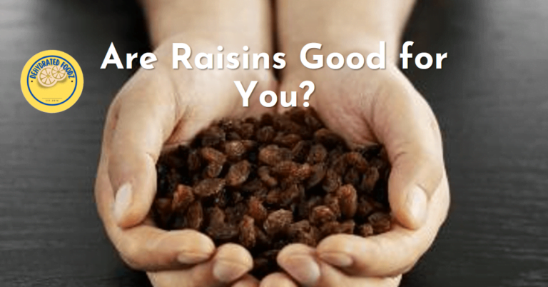 a persons hand full of raisins