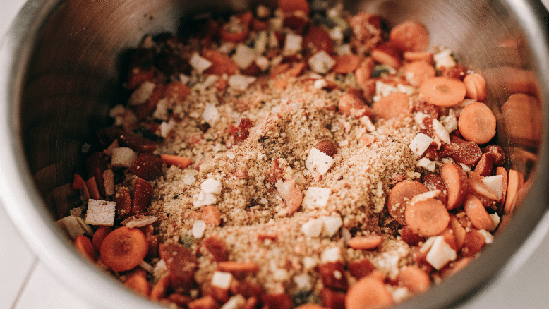 Dried soup mix in a steel bowl.