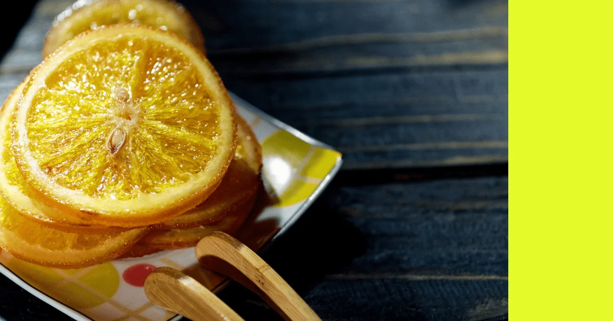 dehydrated orange candied slices on a square ceramic bowl