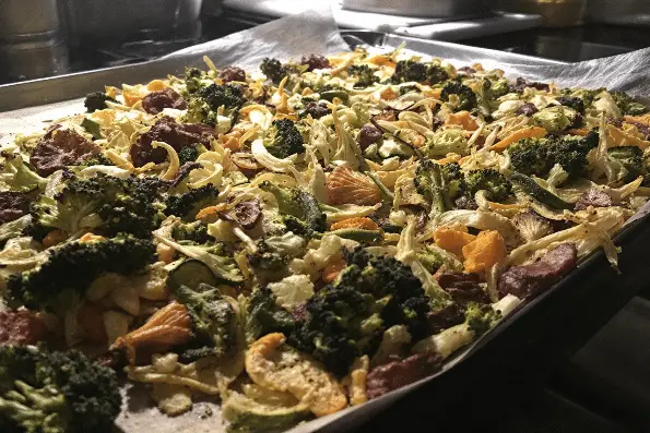 Dehydrated vegetables on a tray in a kitchen.
