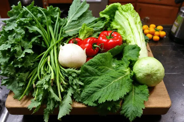 Seasonal Vegetables on a wooden chopping board.