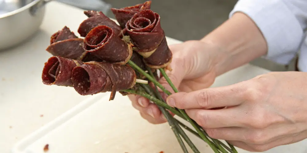 beef jerky flowers being picked up by a person