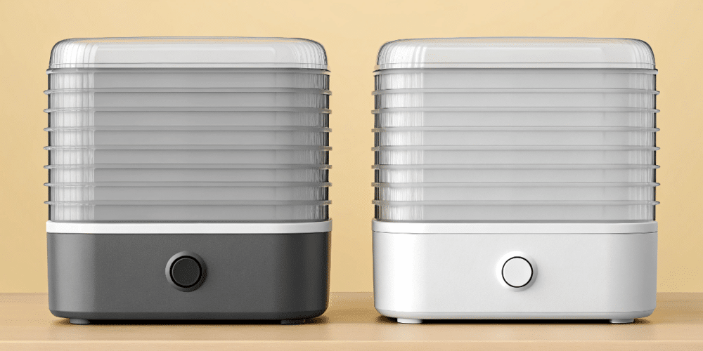 a plastic and sleek food dehydrator side by side.