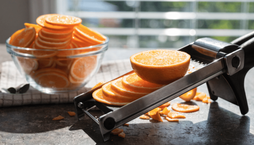 Orange being sliced in circles.