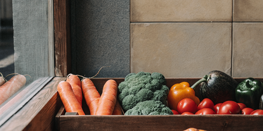 Different Types of Vegetables in a wooden box.
