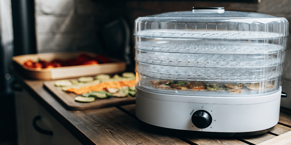 vegetable food dehydrator on a wooden table