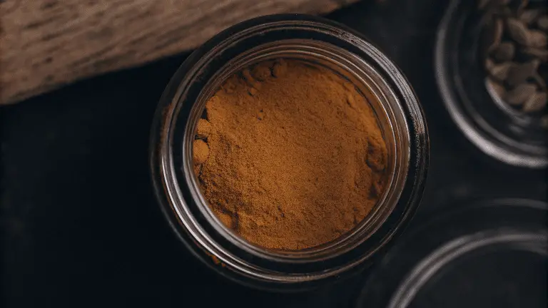 Pumpkin powder in a glass jar.