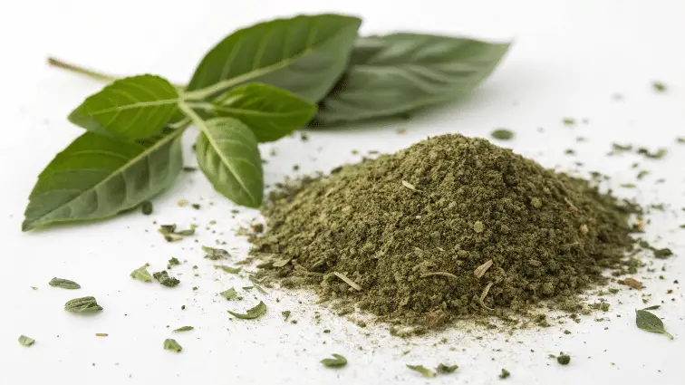 Dried basil powder on a white background.