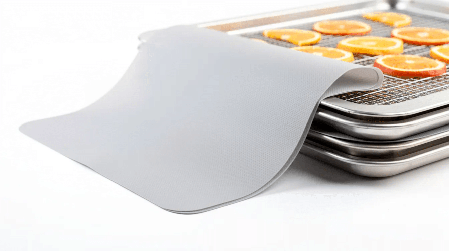 The image features Excalibur ParaFlexx premium sheets designed for food dehydrators, showcasing their non-stick surface ideal for making fruit roll-ups and leathers. These durable, easy-to-clean sheets are perfect for dehydrating various foods without the hassle of sticking or dripping.