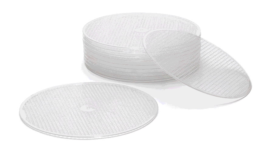 The image features silicone dehydrator tray liners designed for use with food dehydrators, showcasing their flexible, stick-free mesh surface that prevents food items like fruits, vegetables, and jerky from sticking to the dehydrator trays. These reusable sheets are easy to clean and protect the trays while ensuring efficient drying of items such as fruit leather and dried herbs.