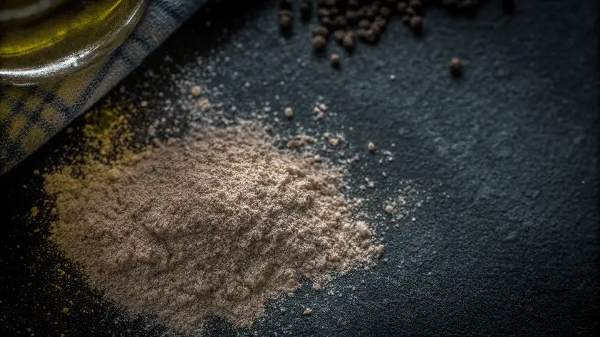A closeup image of an olive powder.
