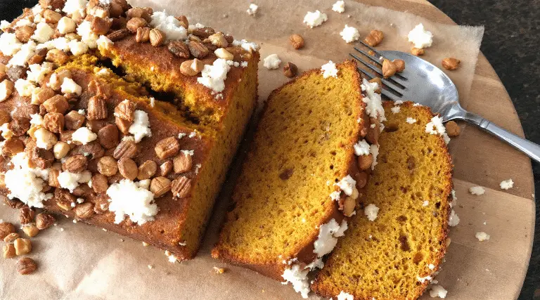 Pumpkin bread next to a spork.